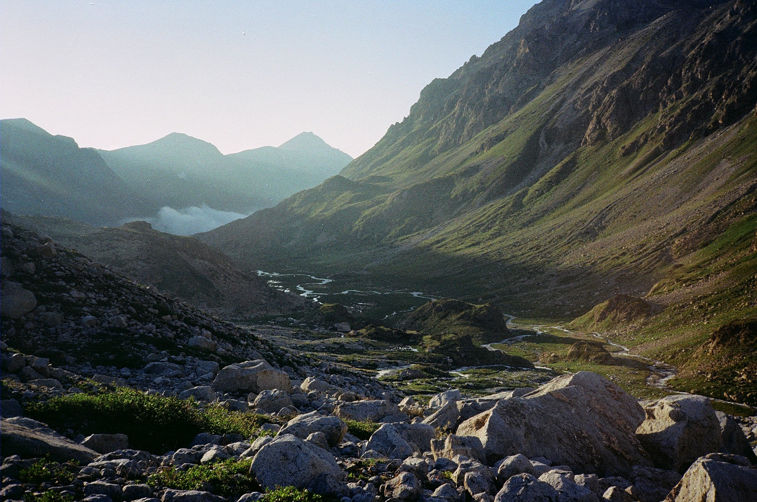 mountain scenery with a river and fog